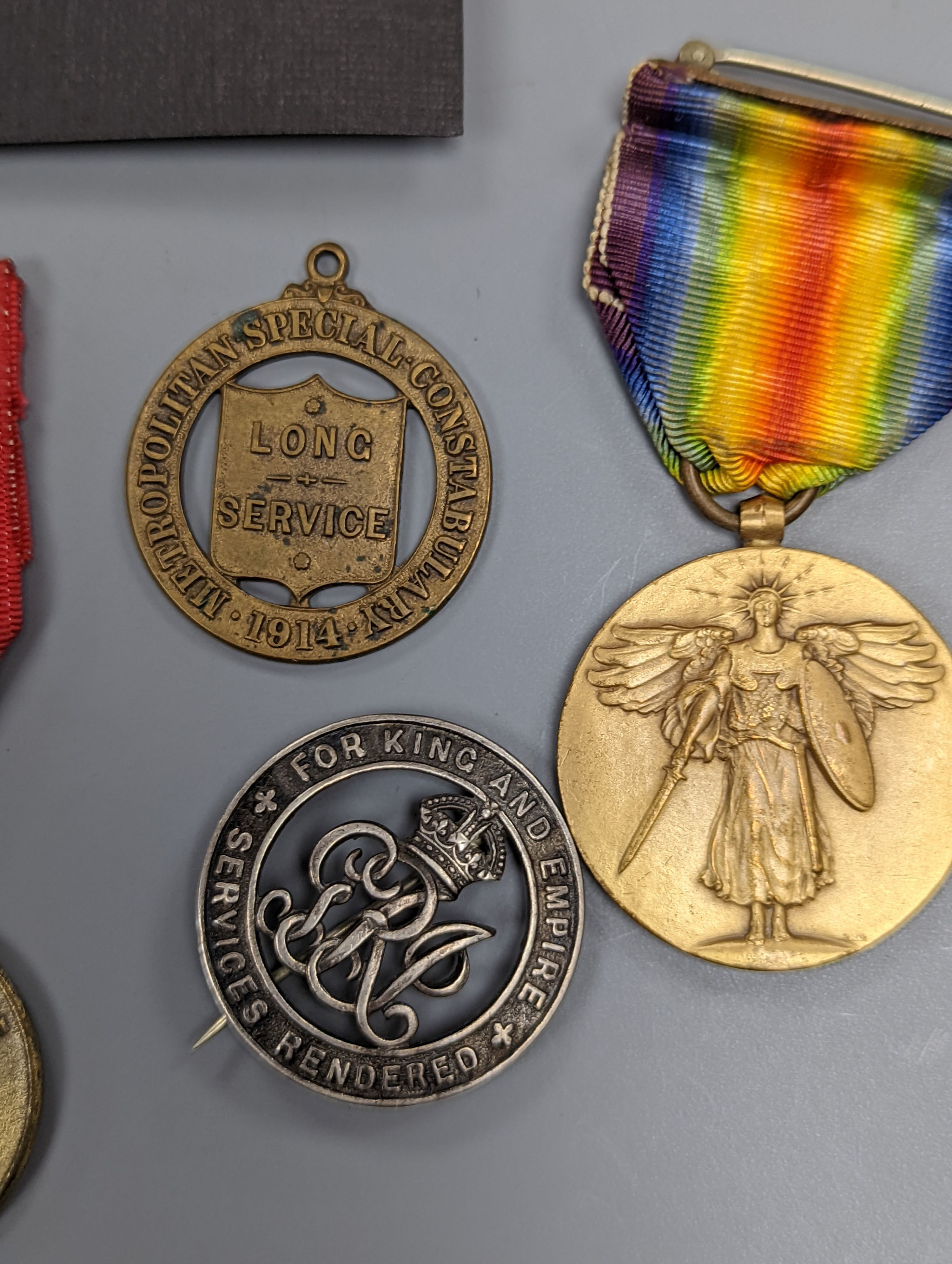 A George VI Territorial For Efficient Service medal, ARP, On War Service, Women’s Land Army badges, UN medal and other badges and medals and a quantity of reference books